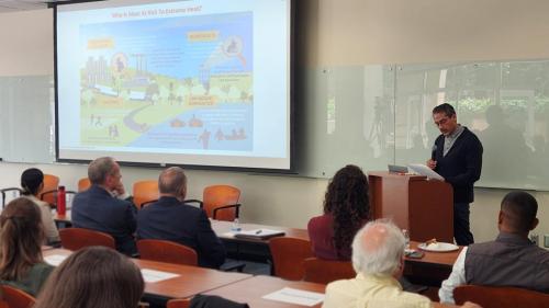 Mike Mendez speaking at symposium